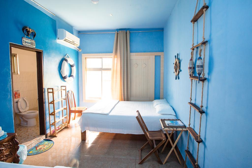 G.T. Guest House Garapan Habitación foto